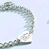 A Jacobson Jewellers Me to You Bear Charm Bracelet